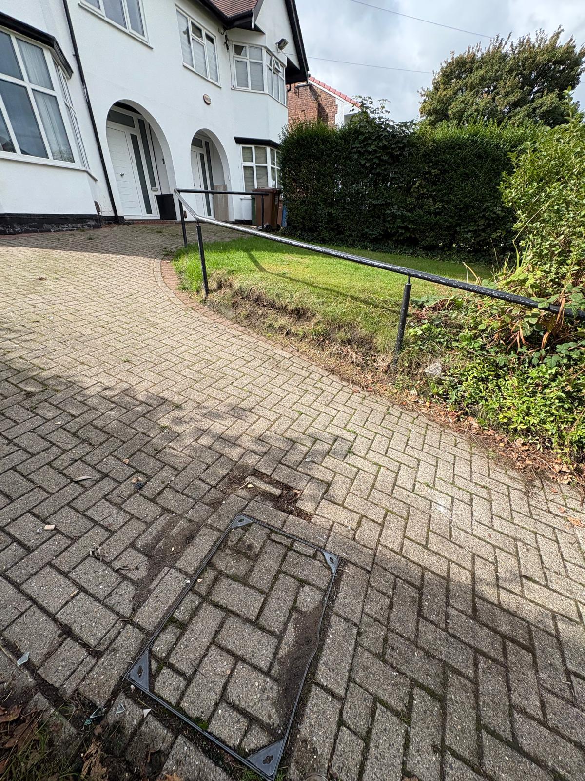 After: the same Manchester property with the driveway and frontage completely cleared.